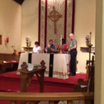 Celebrants Rev Marianne Ell and Pastor Pat A Jones prepare for communion