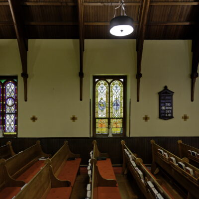 The nave and stained glass windows of St Luke's